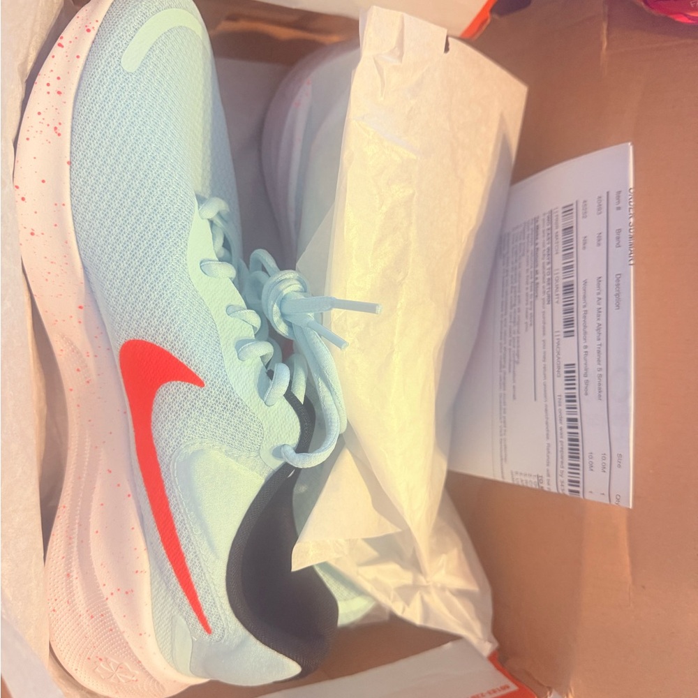 Nike Sky Blue Sneakers with Vibrant Red Logo